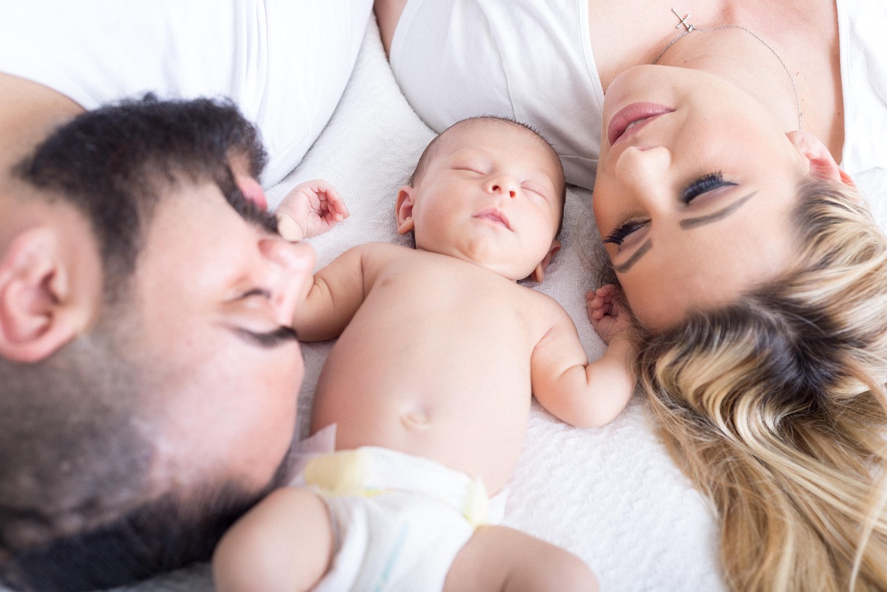 Parents together with their newborn baby